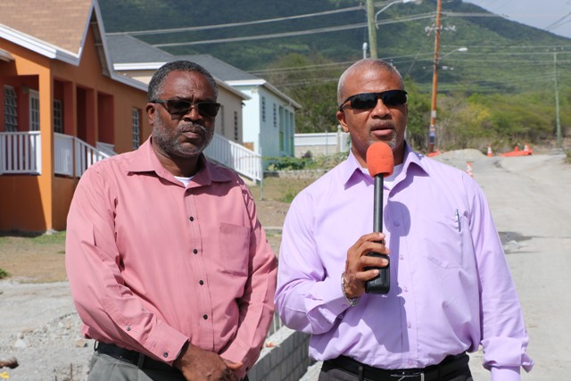 Hon. Spencer Brand, Minister of Communication and Works (left), accompanied by Mr. Denzil Stanley, Assistant Permanent Secretary in the Ministry of Communication and Works