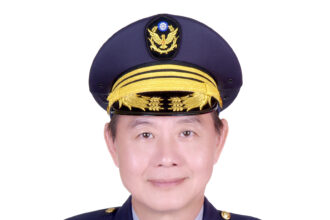 1. Photo of Commissioner Chou Yew woei